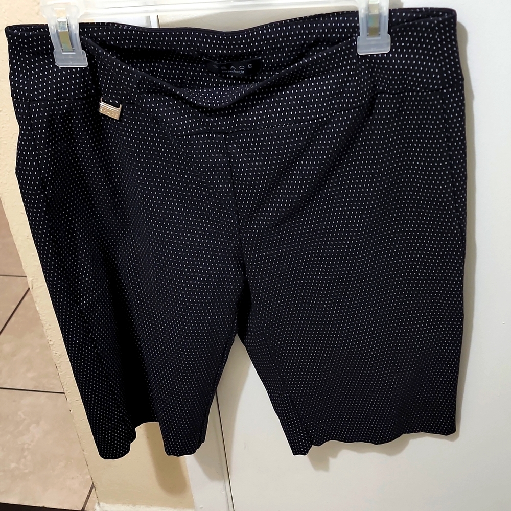I am selling this Black Bermuda Short that has White Poka dots .